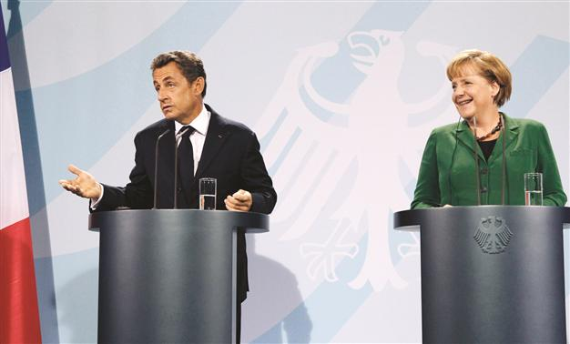 Germany, France promise new plan to tackle eurozone crisis