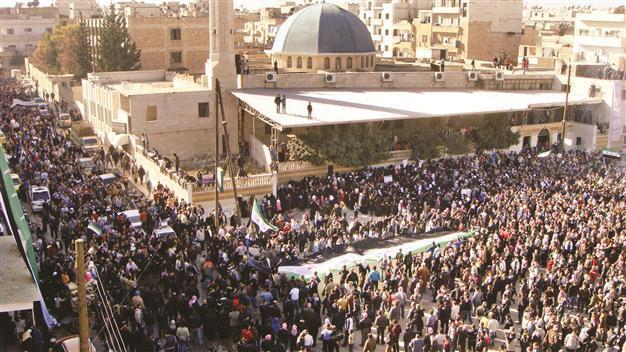 Davutoğlu urges Assad to commence dialogue