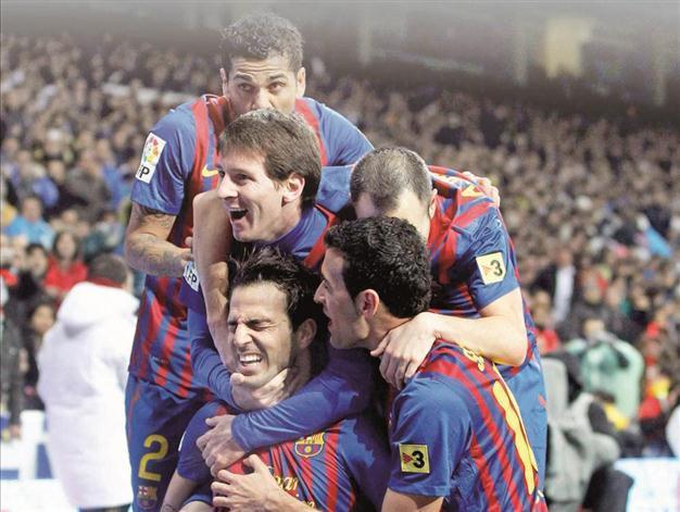 Barca back on track with El Clasico win