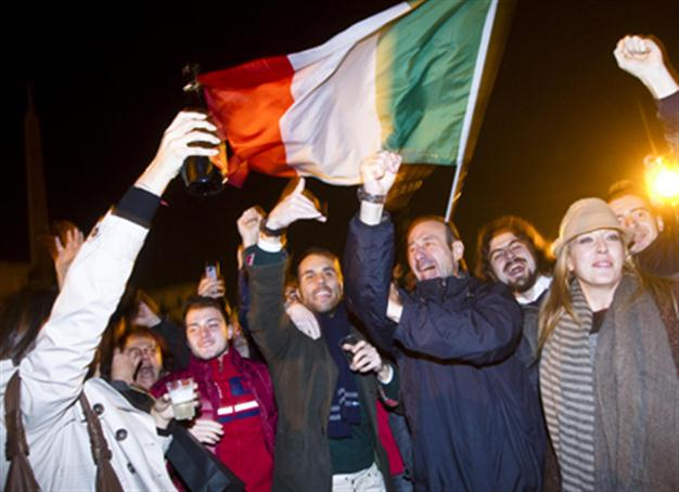 Cheers as Berlusconi quits amid eurozone crisis