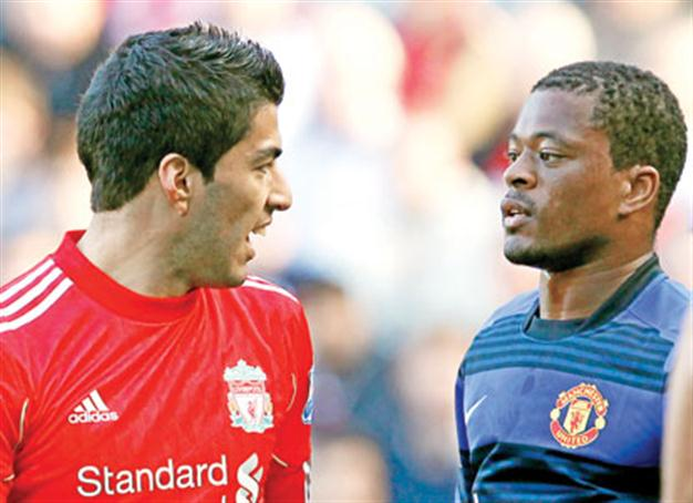 Suarez charged with racially abusing Evra