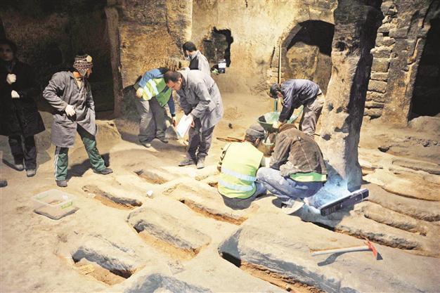 Works unearth graves in underground city