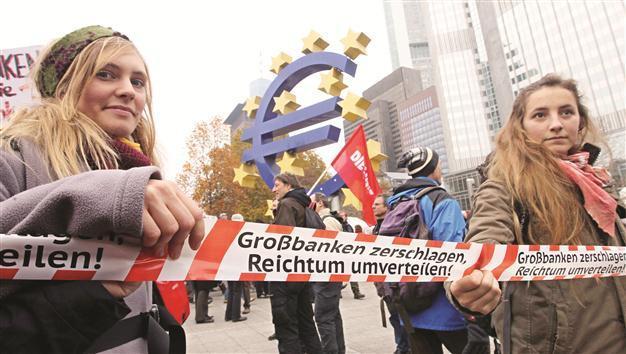 European Central Bank cuts rate before crucial EU summit