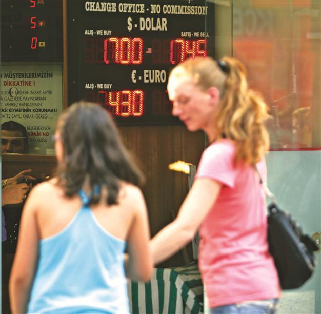 Bank burns reserves to defend lira against dollar