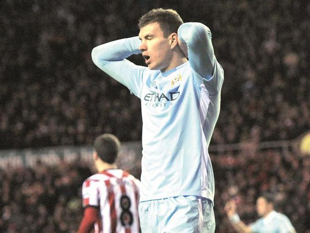 Mancini urges Man City to tighten up