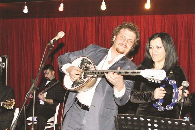Buzuki Orhan on stage with brass band