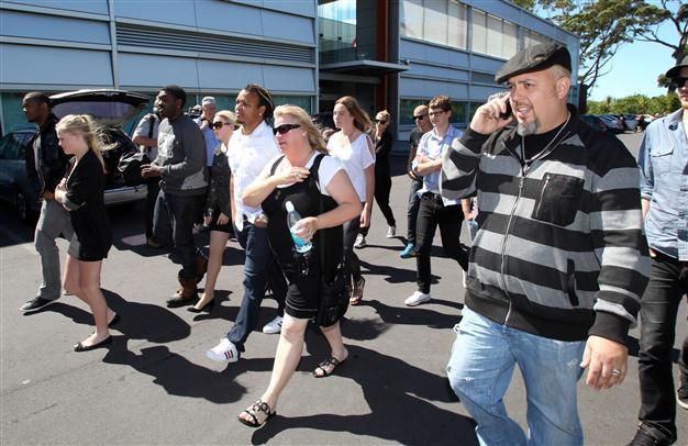 Dotcom denies charges, rival stops file-sharing