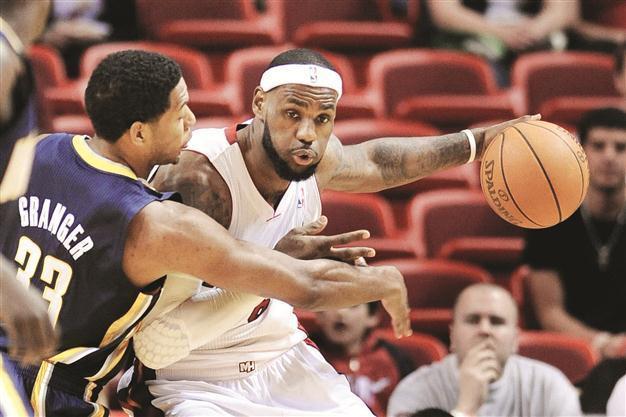 LeBron carries load as Miami shines on