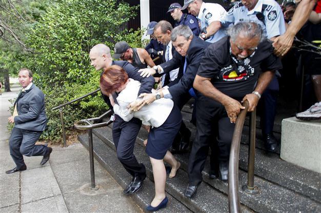 Australia police rescue PM from race protests