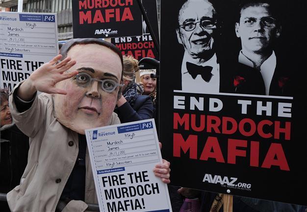 Ex-policeman arrested in UK phone hacking probe