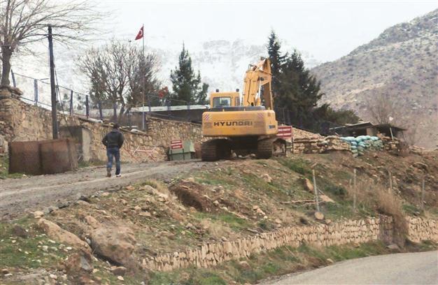 Bones unearthed in suspected mass grave