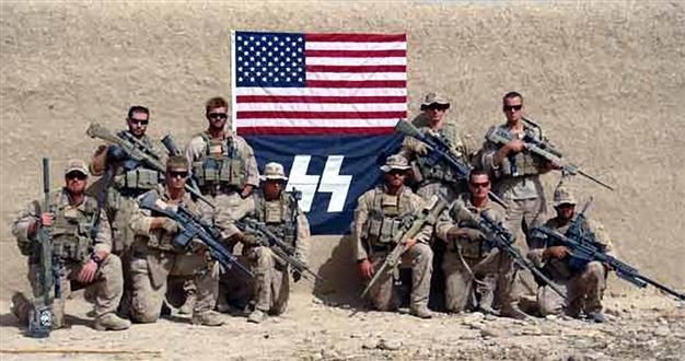 American marines pose with Nazi flag