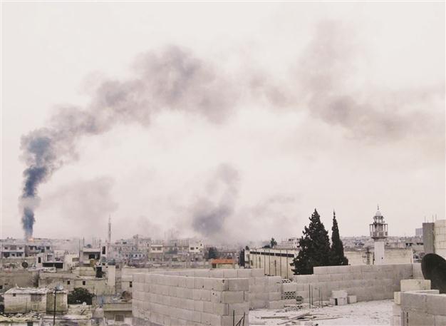 Syrian forces raid Homs, Damascus and Hama