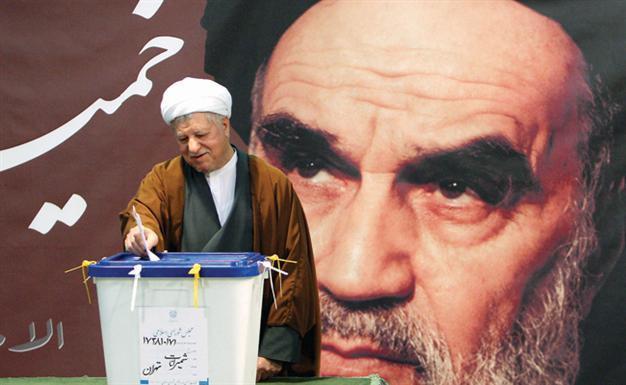 Iranians vote to pick between conservatives