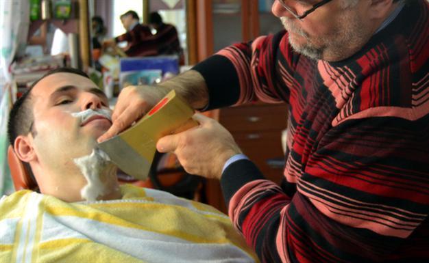 Turkish barber uses fire and ax to shave customers