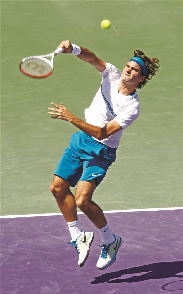 Djokovic, Federer advance, Clijsters crashes out