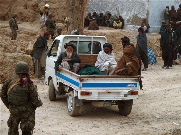 Afghan soldier killed at scene of US killings: official