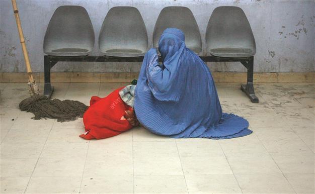 Karzai hit hard on women’s bill
