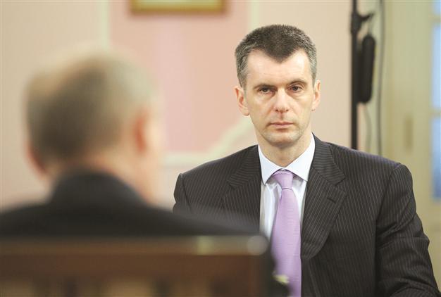 Putin opens cabinet door to rival tycoon Prokhorov