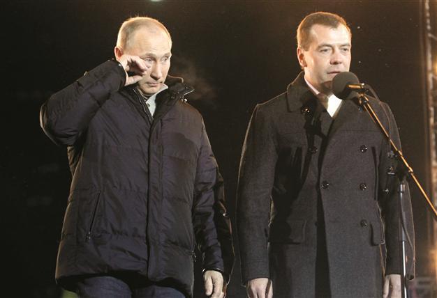 Tearful victor Putin faces critique