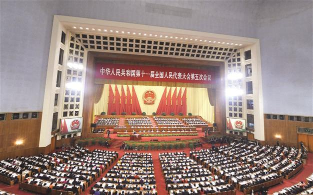 China cuts growth target to 8 year low to boost consumption