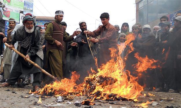 Koran burning anger hits US-Afghan strategy talks