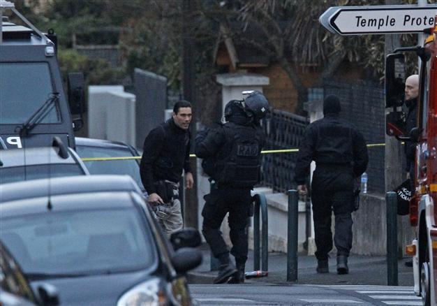 Police inside French shooting suspects apartment: source