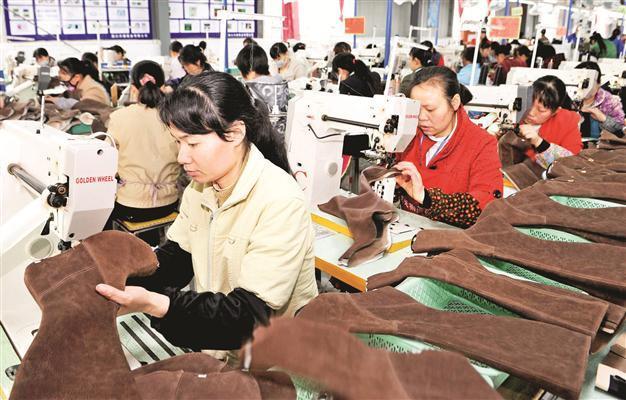 China raises quota for foreign shares