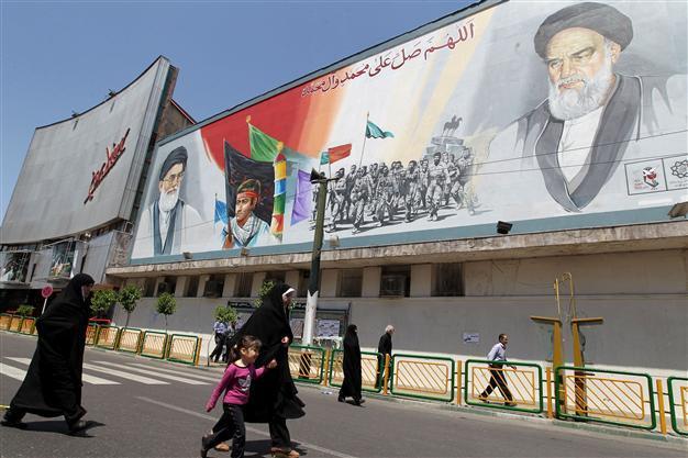 Iran seeks end to sanctions at talks, hits out at France