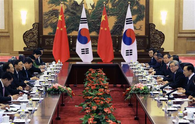 China, Japan, South Korea warn North Korea off atom test