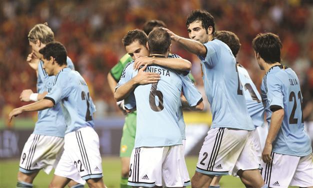 Spain seeks to cap historic treble