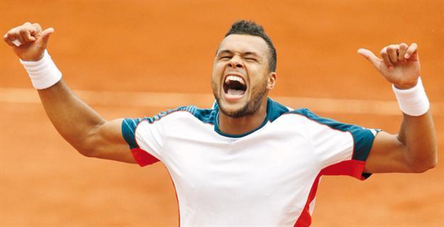 Tsonga sets up Djokovic last-eight clash