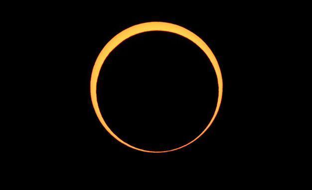 Millions look skyward as eclipse crosses Asia, US