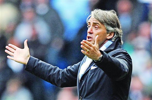 Mancini cautious as City closer to victory