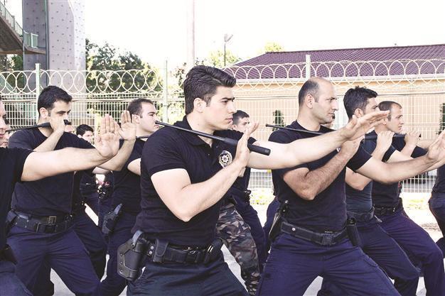 Police show off batons as beating video appears