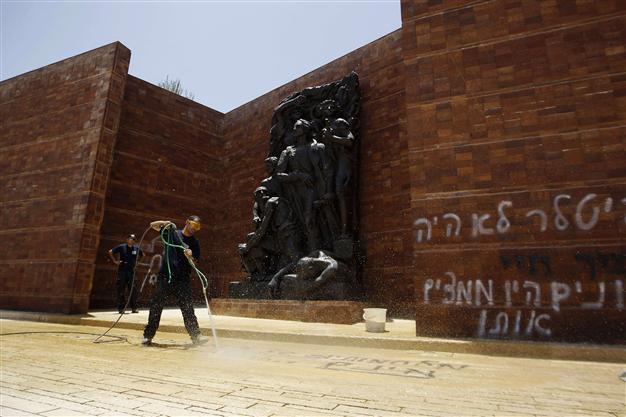 Israel arrests 3 for attack on Holocaust memorial