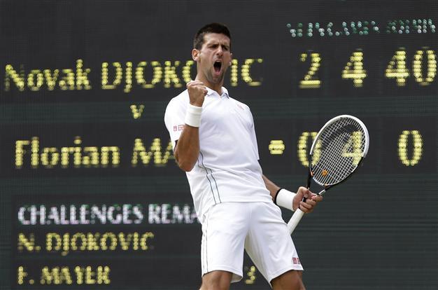 Champ Djokovic sets up Federer showdown