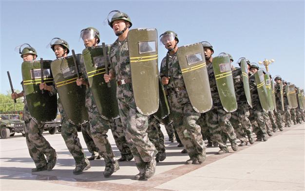 China vows ‘iron fist’ to crush regime opponents