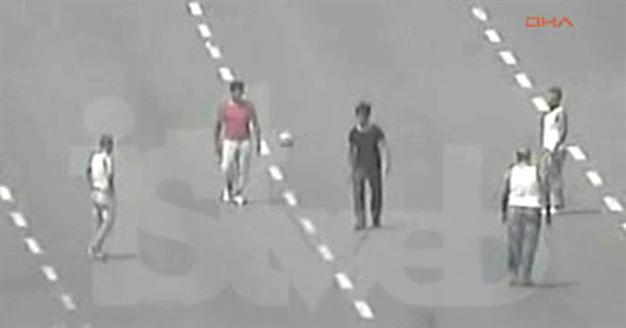 Drivers stranded in traffic play football on Istanbul bridge