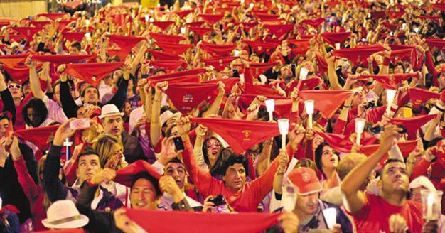 Pamplona’s running of the bulls ends with candlelight ceremony