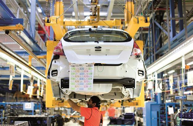 Eurozone factories feel heat in June, job cuts rise