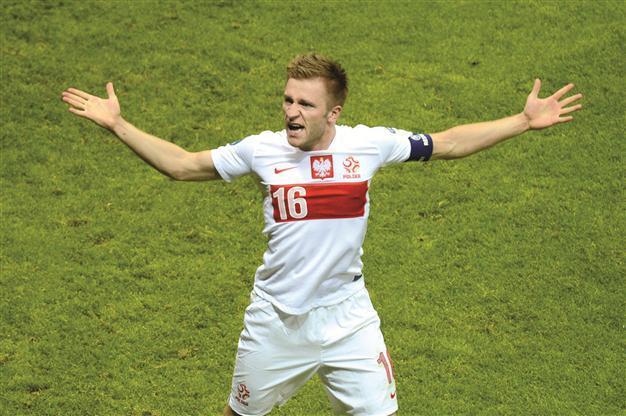 Co-host Poland in must-win game