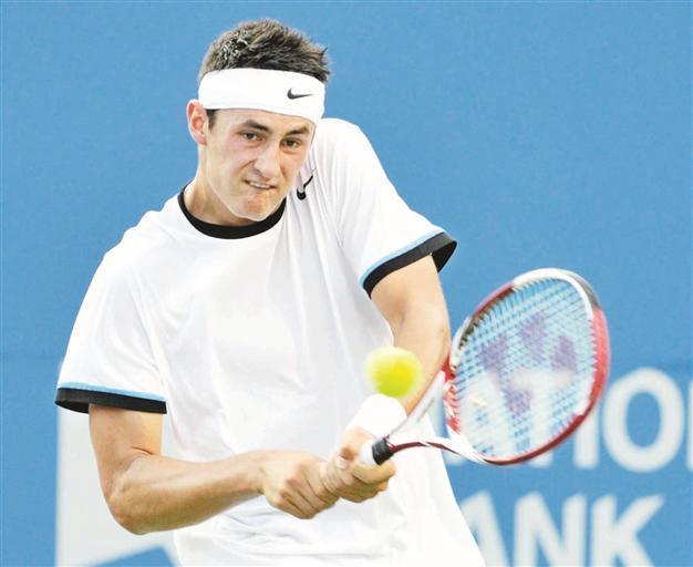 Tomic beats home favorite Harrison