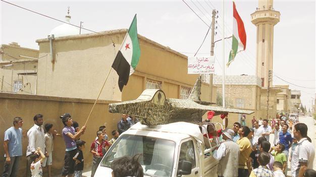 Rebels say downed jet, Damascus denies