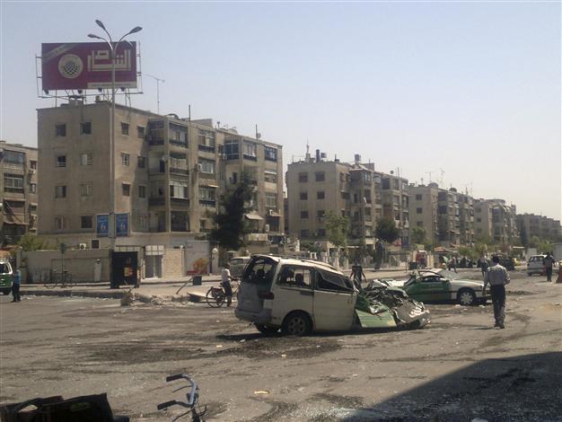 In Syria, mortars kill 21 in Damascus refugee camp