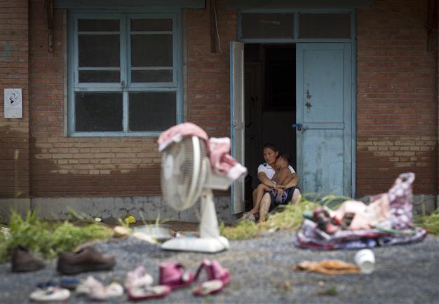 Anger in Beijing as record rains kill at least 37