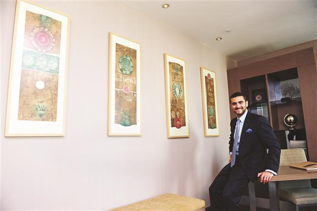Businessman eyes supports art via his hotel and holding