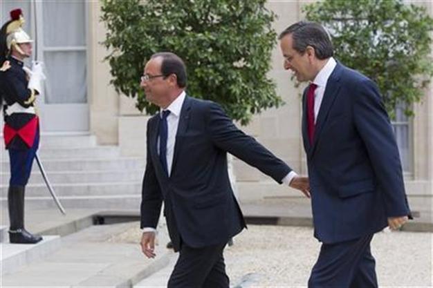 Greek PM gets support but no concessions from Paris, Berlin