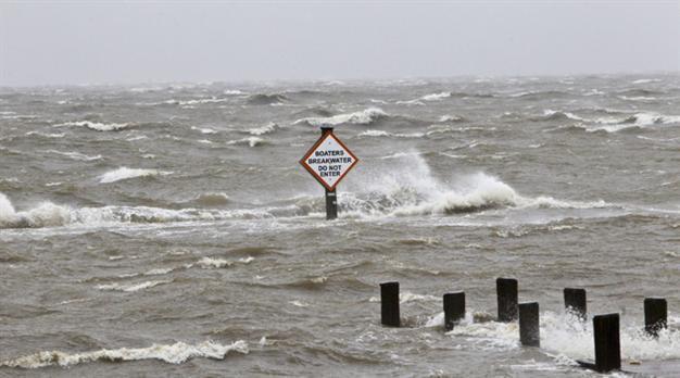 Isaac waters top Louisiana levee, homes flooded