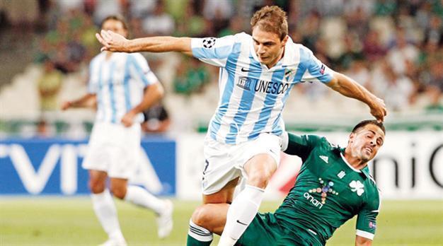 Malaga advances to CL groups